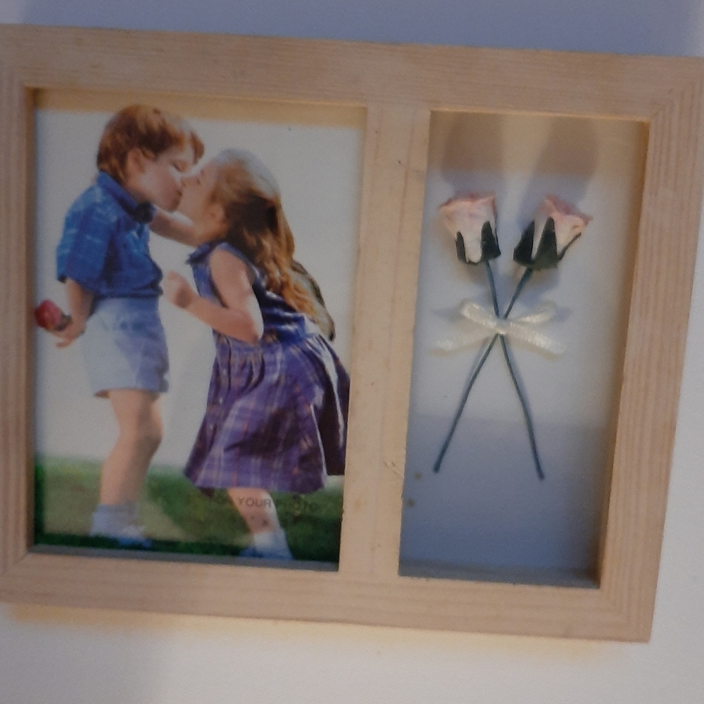Unfinished wood frame. Flowers on.one side